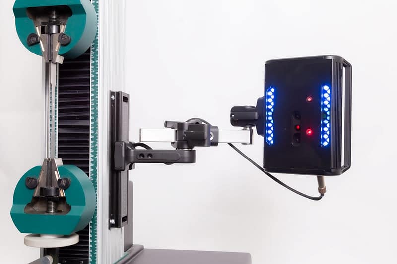 Optical extensometer mounted to universal test machine